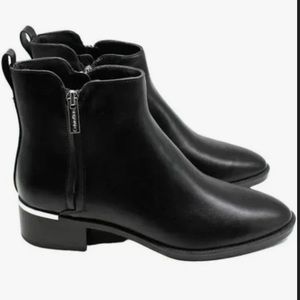 Calvin Klein black leather booties with silver accents